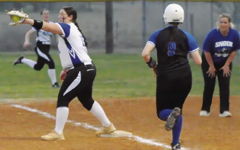 SNOOK’S HEIDI JANAC runs down the first base line, but was out at first during the Snook-Mumford game last Friday. Tribune photo by Denise Squier