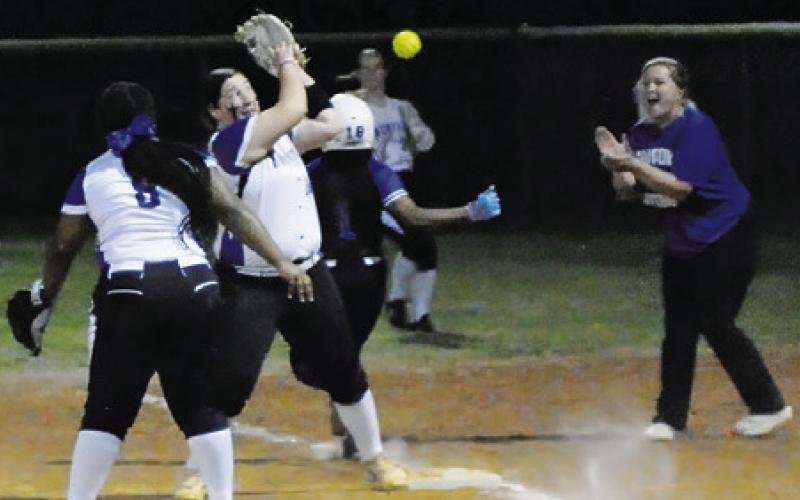 SNOOK’S BRAYNIJA POOL gets safely to first during the Snook-Mumford game last Friday in Snook. Tribune photo by Denise Squier