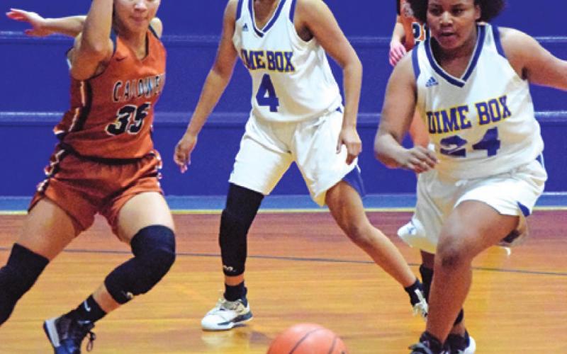 CALDWELL’S ANDREA FLORES races a Dime Box player for the ball during a tournament game last Thursday afternoon in Dime Box.
