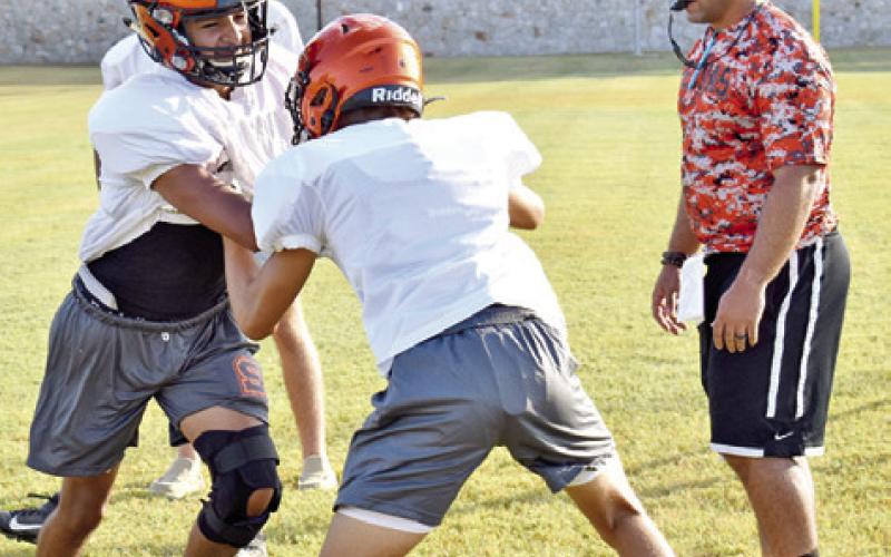 SOMERVILLE PLAYERS WORK on technique during drills at the Monday, Aug. 15, practice. -- Tribune photo by Roy Sanders