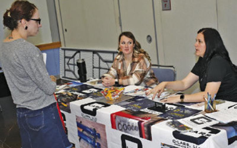 CAROLYN JANAC and Falynne Byrne of CLARS greets a visitor on Oct. 30 at the job fair at the Caldwell Civic Center.