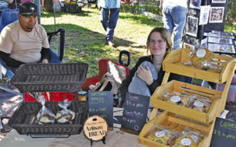 SHYANN RAMIREZ AND Ignacio Ramirez work at their booth on Sunday, Nov. 2, at the Somerville Farmer and Artisan Market.