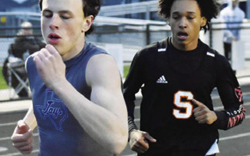 SNOOK’S ETHAN Janac and Somerville’s Jeremy Vela run in the 800-meter run. Vela wins the race with a time of 2:17.31. Janac finishes third with a time of 2:18.65.