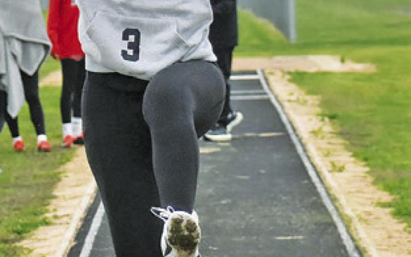 EMMA WILLIAMS jumps at last week’s Bluejay Relays. -- Tribune photo by Roy Sanders