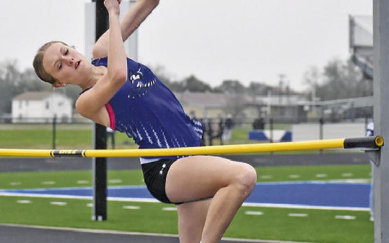 SNOOK’S DAKOTA KIENOW competes in the girls’ high jump at the Bluejay Relays last Thursday. She won the event with a leap of 5 feet.