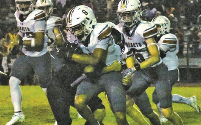 CALDWELL’S LOGAN CARTER carries the ball last Friday against Brazos in Wallis. Caldwell lost 40-0 and faces Somerville this week. Tribune photo by Roy Sanders