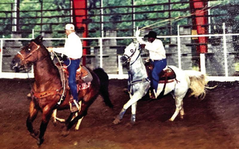 HODGES ON HIS “ONE-OF-A-KIND” horse, Rebel, heeling at a local roping. Photo courtesy of Alfred Hodges