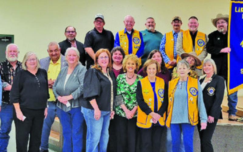 THE LAKE SOMERVILLE LIONS Club held its Charter Night dinner, sponsored by the Caldwell Burleson County Lions Club on Thursday, Jan. 29, at the Burlson County Expo Center. District Governor Kelli Higgins (first row, far left) and Club President Jason Rhodes (top row, far right) participated in the charter signing ceremony. Past District Governor Lisa Free Martin (first row, far right) was the installing officer.
