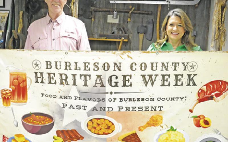 STEVE TUNNELL AND AMY Jurica with the Burleson County Historical Commission hold this banner to announce next week’s Heritage Week, with a theme of “Food and Flavors of Burleson County: Past and Present.” -- Tribune photo by Denise Squier
