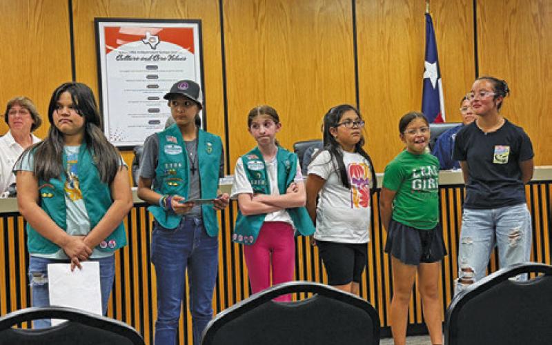 AREA GIRL SCOUTS WERE recognized during Monday’s Caldwell School Board meeting. The Girls Scouts collected 1,000 pounds of plastic and used that collection to make a “buddy bench” to place on the Caldwell Intermediate School campus. Tribune photo by Denise Squier