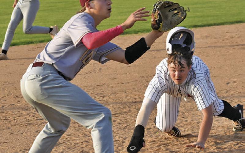 SOMERVILLE’S LUKE MOSES gets ready to slide into third base last Friday in the Yeguas’ season finale against Milano. Tribune photo by Roy Sanders
