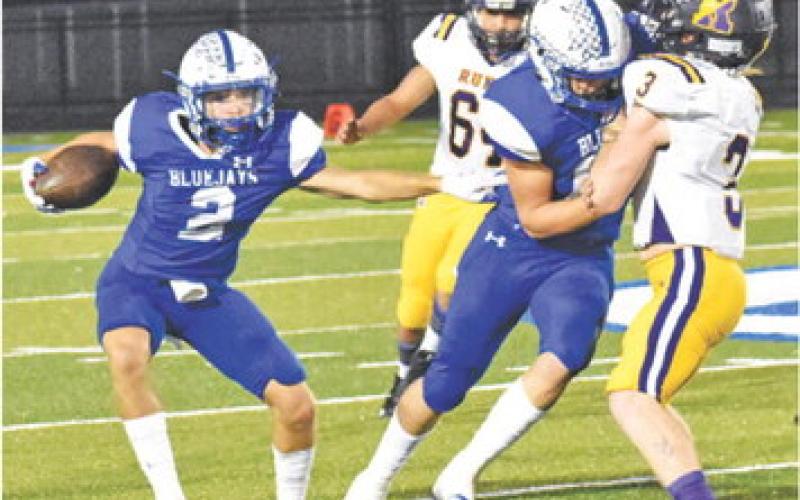 LANCE LARA CARRIES the ball for Snook against Runge in the district opener last Friday. -- Tribune photo by Roy Sanders
