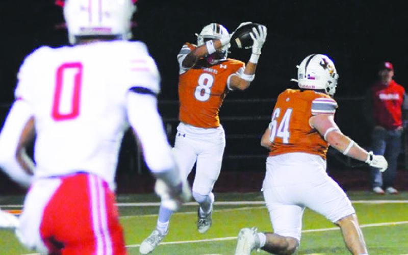 DYLAN CARTER MAKE this catch against Bellville. Also picture is teammate Landon Barnes. The game was the Hornets’ season finale. Tribune photo by Denise Squier