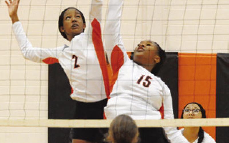 BOTH KARYS ELLIS and Keira Moore jump for the ball during the Somerville-ILTexas match last Friday night in Somerville. Tribune photo by Denise Squier