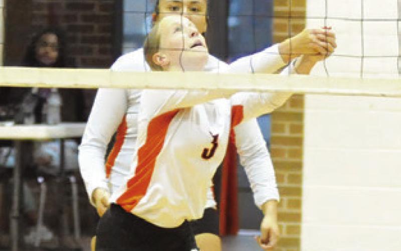 AUBREY FLENCHER bumps the ball during the Somerville-ILTexas match last Friday night in the Somerville High School Gym. Tribune photo by Denise Squier