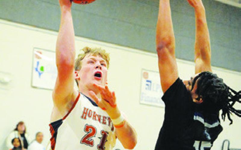 HARRISON NOVAK shoots against Manor New Tech. -- Tribune photo by Denise Squier
