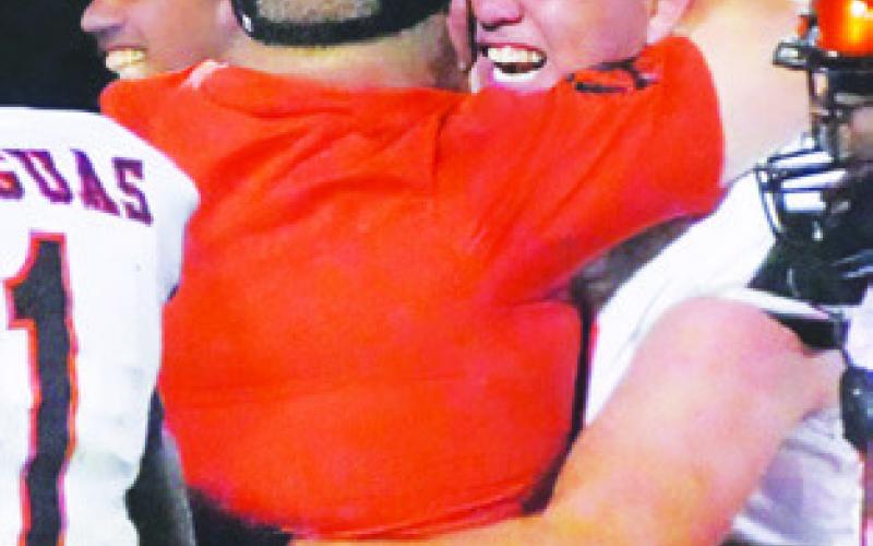 NIC CONNELLY celebrates Somerville’s 42-41 overtime victory of Burton last Friday.
