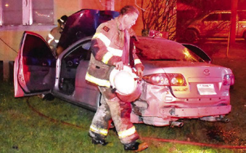 CALDWELL FIRE CHIEF David Pevehouse works at this Monday morning accident off Temple Street near the State Highway 21 intersection. No information on the accident was available at press time.