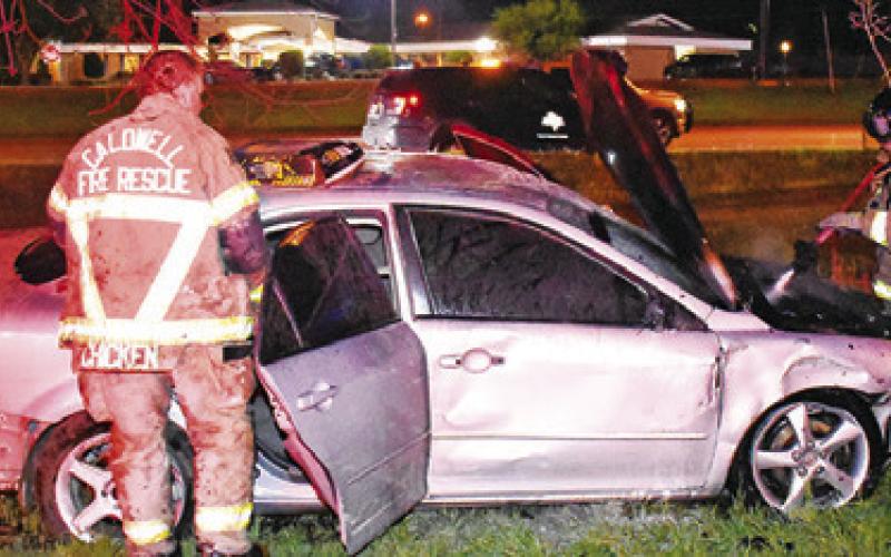 CALDWELL FIREFIGHTERS WORK the scene of this early Monday morning traffic accident off Temple Street near the State Highway 21 West intersection. Caldwell police investigated the crash.