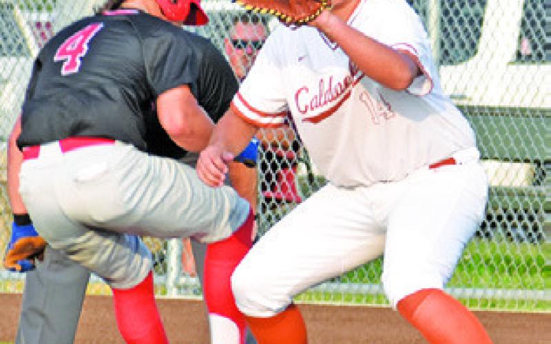 CALDWELL FIRST baseman Preston Supak prepares to make this catch and tag this Salado player. -- Tribune photo by Roy Sanders