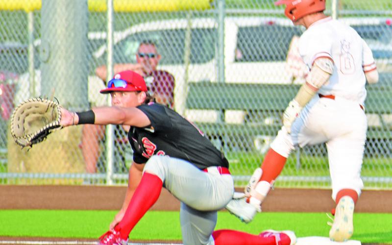 HAYS BEAVERS OF Caldwell gets to first base safe in game one of the area playoff against Salado. -- Tribune photo by Roy Sanders