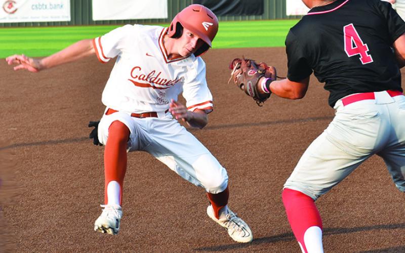 CALDWELL’S DANIEL BARDIN runs for third base in the first game of the area playoff against Salado. -- Tribune photo by Roy Sanders
