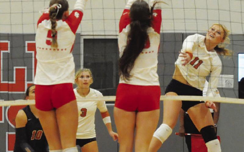 CALDWELL’S REESE MCMANUS gets one of her 17 kills against Bellville during the Lady Hornets’ loss to the Brahmanettes. Tribune photo by Denise Squier