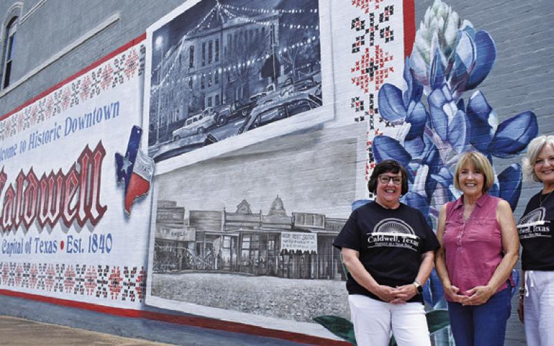 LIA ZACCAGNINO, BETSY WELHAUSEN and Janice Easter stand in front of this mural. Tribune photo by Roy Sanders