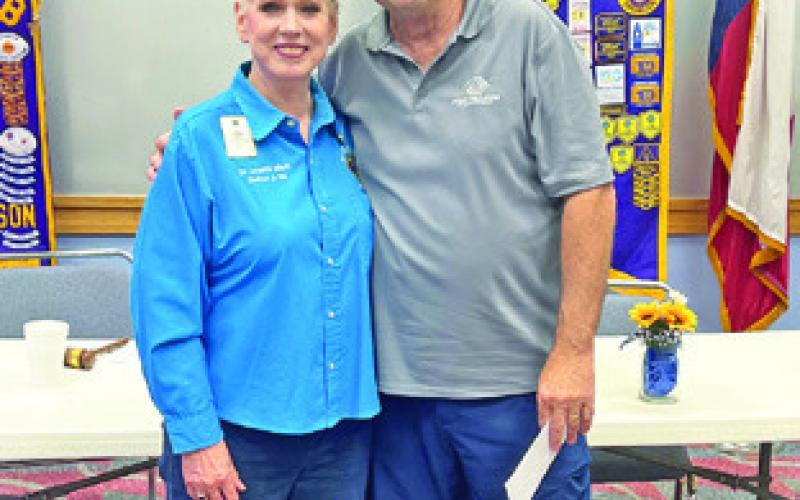 CBC LIONS CLUB President Johanna Elliott presents a check to Mike Patranella for the Caldwell Boys and Girls Club this past Thursday.