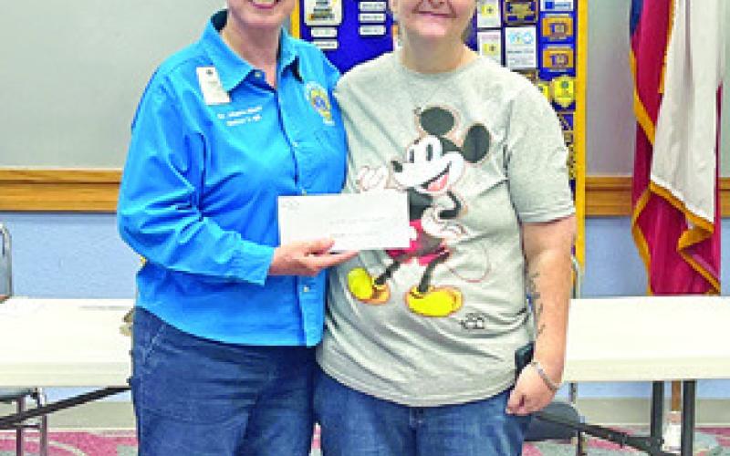 CBC LIONS CLUB President Johanna Elliott presents a check to Melinda Palicka representing In God’s Hands Ministry Food Pantry this past Thursday.