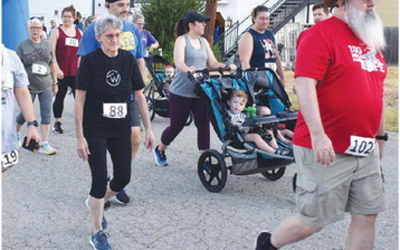 PARTICIPANTS JOIN THE 5K run and walk early Saturday to begin the Kolache Festival in Caldwell. -- Tribune photo by Roy Sanders