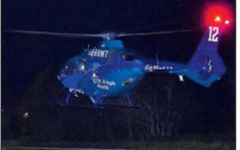 A HELICOPTER transports a patient on Thursday, Nov. 20, at an accident on State Highway 21 West near F.M. 60. No details on the accident were available at press time.