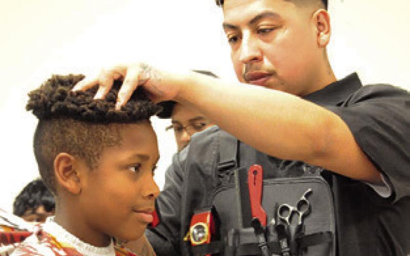 MANY BURLESON COUNTY STUDENTS TOOK advantage of the free haircuts at Monday’s “Back-to-School Blast” at the Burleson County Expo Center. Tribune photo by Denise Squier