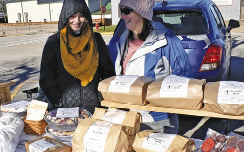 DENNILLE KNOWLTON and Joslyn display Dannille’s Bread on Saturday, Jan. 11, at the farmers market in downtown Caldwell.