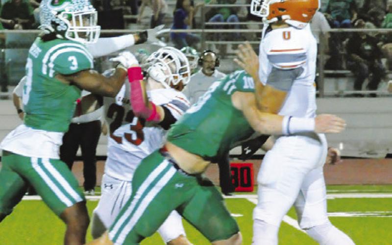 CALDWELL’S COY BECKA hurls this pass against Cuero last Friday. Caldwell lost 62-7. Tribune photo by Denise Squier