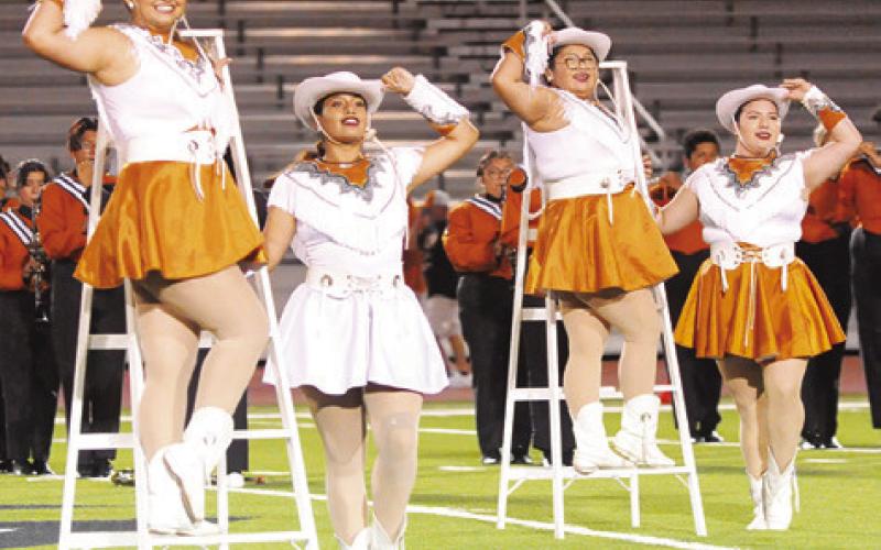 THE CALDWELL HIGH SCHOOL Honeybees performed during the Caldwell-Cuero halftime in Cuero last Friday. Pictured, from left, are Angelina De La Rose, Lieutenant Shundale Campise, Dulce Medina and Olivia Gonzales. -- Tribune photo by Denise Squier