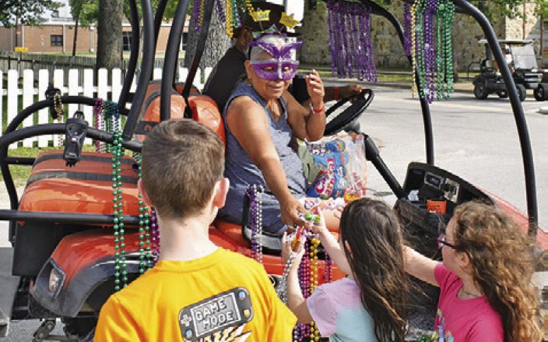 CHILDREN ENJOY THE motorcycle parade on Saturday in downtown Somerville. The parade was part of the Crater Motorcycle Rally.