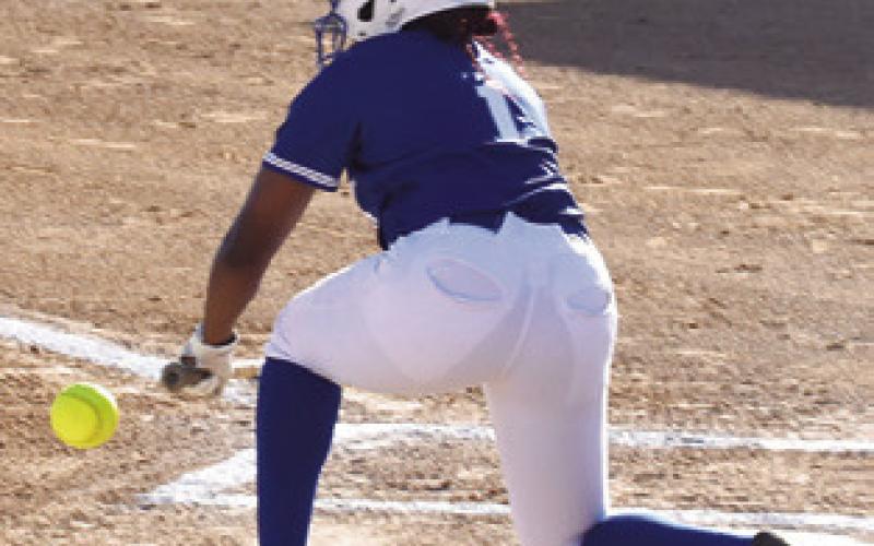 BRAYNIJA POOL hits the ball during the Snook-Somerville game last week. Pool had an amazing game at the plate with a double, triple and an inside the park home run.