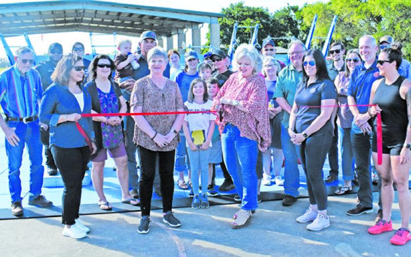 CALDWELL MAYOR JANICE EASTER cuts the ribbon at the fitness court launch.
