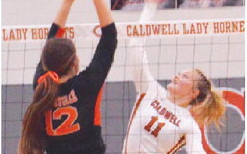 REESE MCMANUS goes for a kill during the Caldwell-Smithville district match last week.