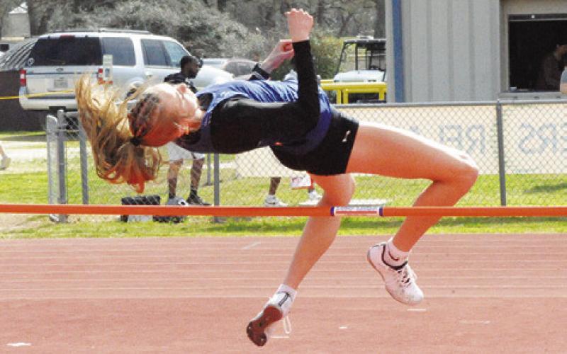 SNOOK’S DAKOT KIENOW places first in the girls varsity high jump at last week’s Koppers Relays with a height of 5 feet 2 inches. Tribune photo by Denise Squier