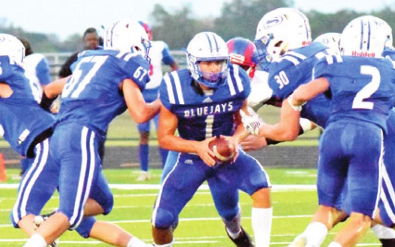SNOOK QUARTERBACK GARRETT Lero gets ready to hand off the ball. Also pictured are Jared Bryan, Luke Jacubik, Ryder Becka and Lance Lara. -- Tribune photo by Bailey Brown