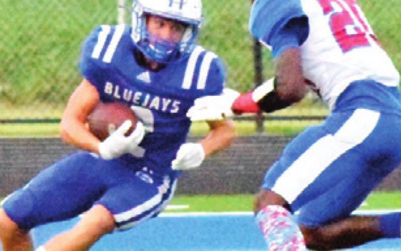 LANCE LARA carries the ball for Snook.