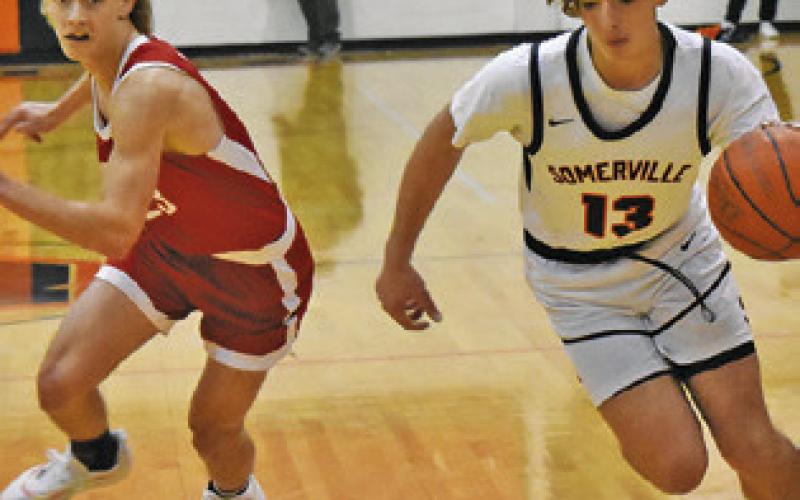 TANNER MOORE OF Somerville dribbles the ball against Burton. Tribune photo by Roy Sanders