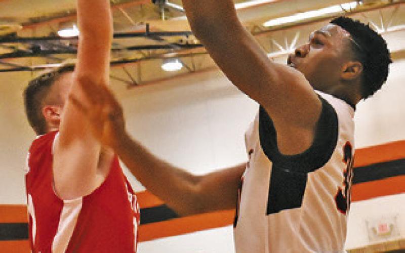 JAKEITH DANIELS of Somerville takes a shot in the Burton game. Somerville won 48-45. Tribune photo by Roy Sanders