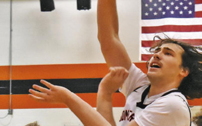 IRMAN SADIC OF Somerville takes a shot against Burton. Tribune photo by Roy Sanders