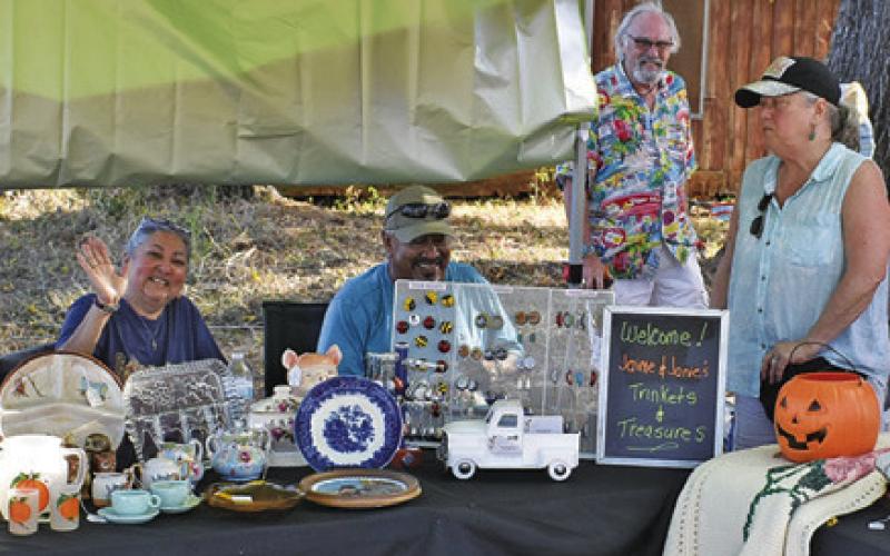 VENDORS ENJOY GREETING visitors at the Yellow Prairie Market on Saturday, Oct. 18, in downtown Chriesman.
