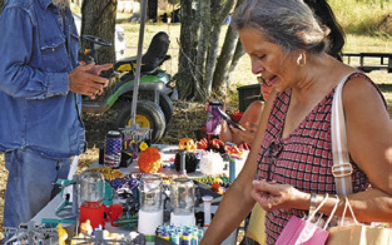 NUMBEROUS VENDORS had products on display at the Yellow Prairie Market last Saturday in downtown Chriesman.
