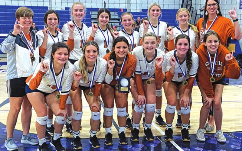 THE LADY HORNETS CELEBRATE after winning the silver bracket at the Navasota Varsity Volleyball Tournament in August. Coach Jane Anne Giese earned her 450th win at the event.