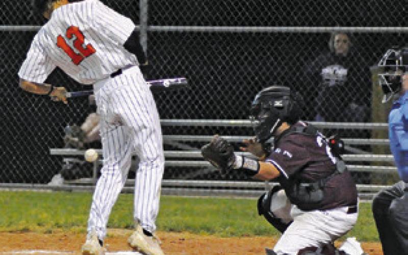 BATTER KYLE BROOKS of Somerville is hit by a pitch against Fayetteville. -- Tribune photo by Denise Squier